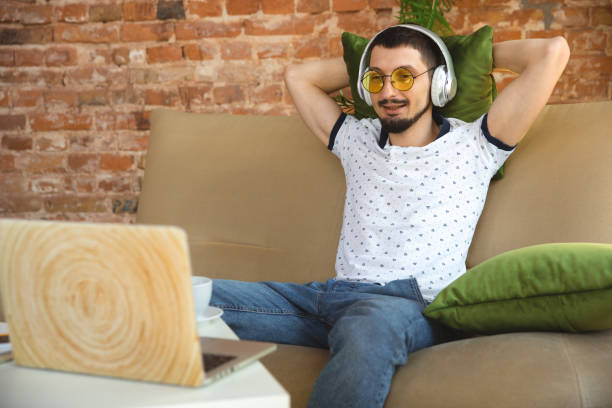 istock Man working from home during coronavirus or COVID-19 quarantine, remote office concept 1219360199
