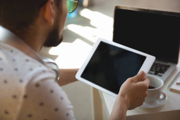istock Man working from home during coronavirus or COVID-19 quarantine, remote office concept 1219360204
