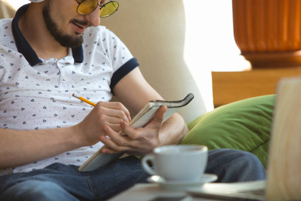 istock Man working from home during coronavirus or COVID-19 quarantine, remote office concept 1219360208