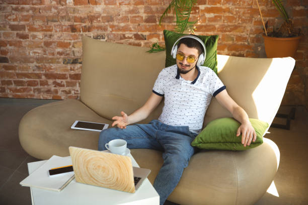 istock Man working from home during coronavirus or COVID-19 quarantine, remote office concept 1219360216