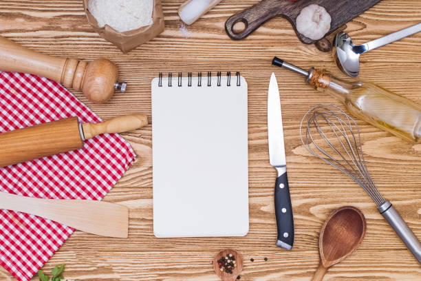 istock Blank notepad paper for text or recipes and kitchen utensil on wooden table 1219362205