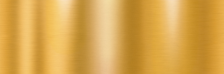 Golden brushed metal surface. Long metallic texture with shiny light reflections for a background.
