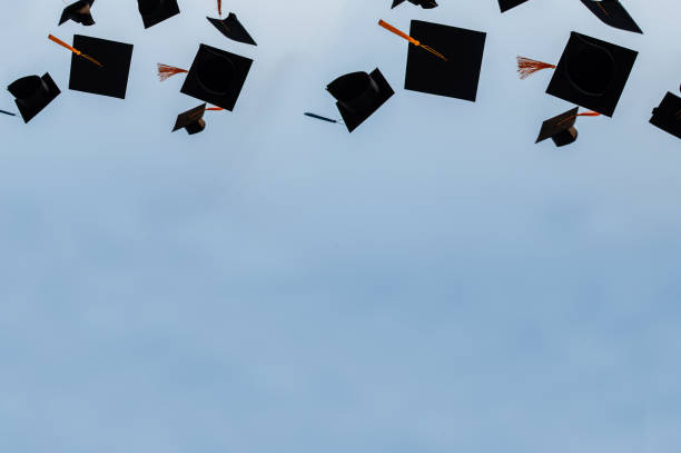 istock Graduation hat Thrown in the Air with bluesky abstract background. 1219362915