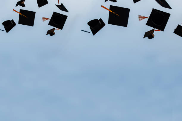 Graduation hat Thrown in the Air with bluesky abstract background. Graduation hat Thrown in the Air with bluesky abstract background. mortarboard photos stock pictures, royalty-free photos & images