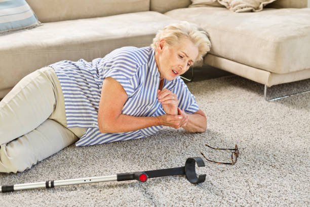 istock Elderly lady lying on the floor after moving down 1219363117