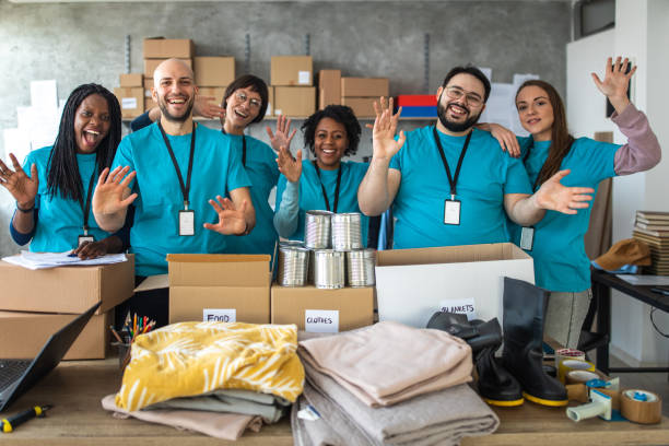 istock Happy multi-ethnic volunteers at charitable foundation 1219364648