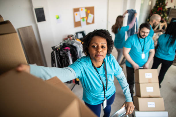 istock Volunteer preparing donation boxes for delivery 1219364853