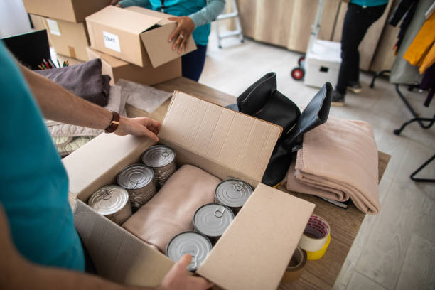 istock Volunteers preparing donations for delivery 1219364990
