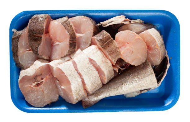 istock Raw steaks of whiting fish in blue plastic tray 1219365216