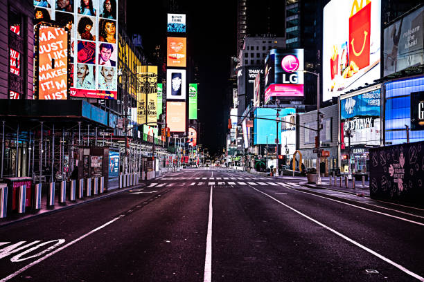 Empty Times Square Images of an empty Times Square at 8PM during the COVID-19 crisis. times square manhattan stock pictures, royalty-free photos & images