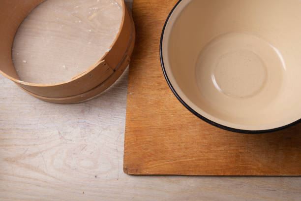 istock Large bowl, cutting board, sieve for sifting flour on the table. 1219368508