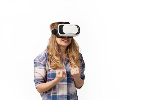 istock Emotional caucasian woman using VR-headsed isolated on white studio background, technologies. Scared 1219368915