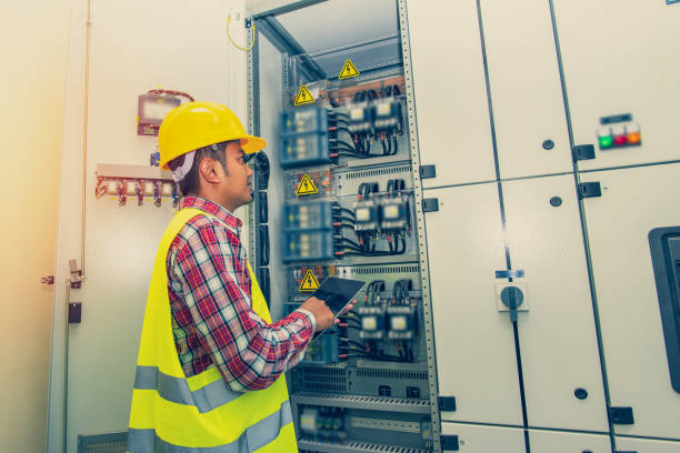 istock Engineer standing in front of the control panel in the control room. 1219370481