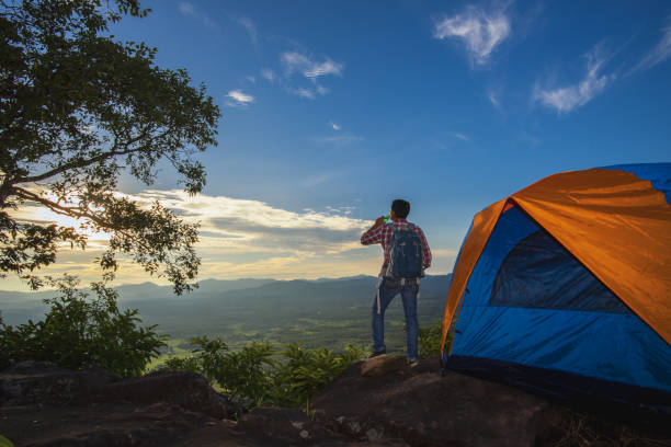 istock Tourists pitch a tent on the cliff. 1219372407