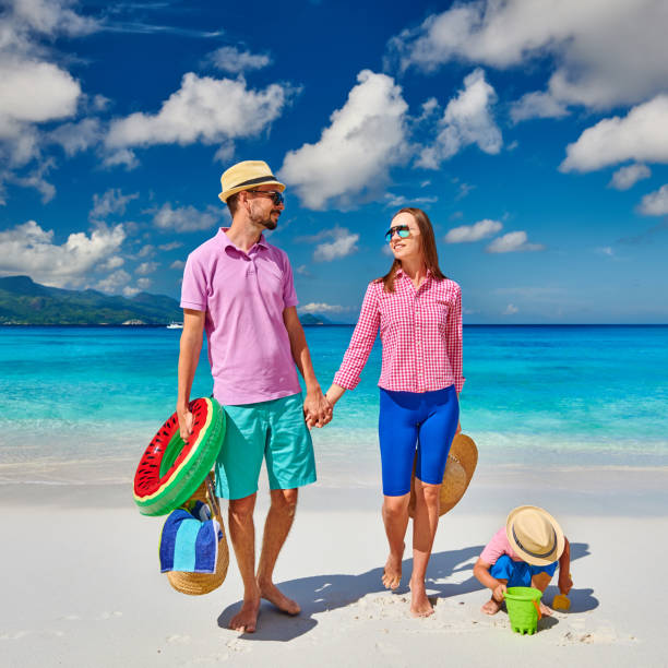 istock Family with three year old boy on beach. Seychelles, Mahe. 1219372605