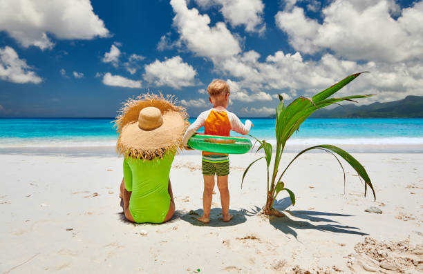 istock Toddler boy on beach with mother 1219372700