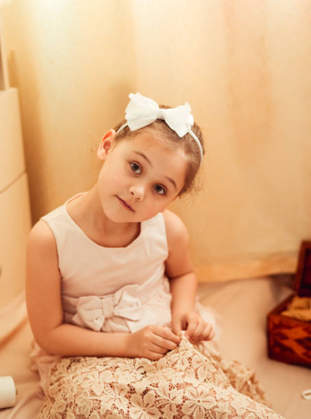 istock little girl is engaged in sewing at home, needlework 1219376109