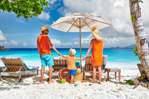 istock Family with three year old boy on beach. Seychelles, Mahe. 1219377148