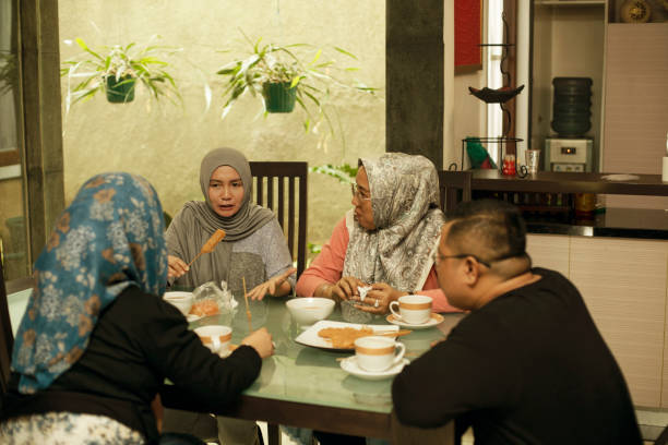 istock happy asian friends having iftar together 1219377415