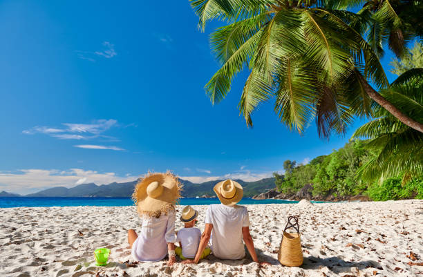 istock Family with three year old boy on beach. Seychelles, Mahe. 1219378416