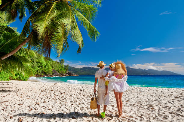 istock Family with three year old boy on beach. Seychelles, Mahe. 1219378426