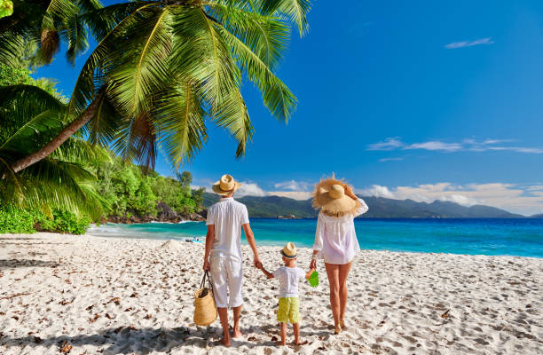 istock Family with three year old boy on beach. Seychelles, Mahe. 1219378433