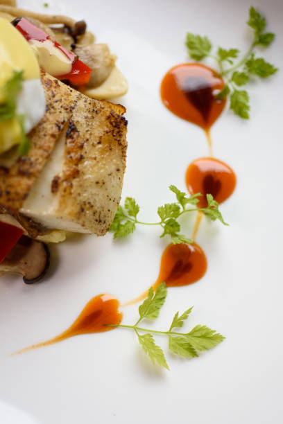 Fine dinning heatt shape food dressing  on white plate