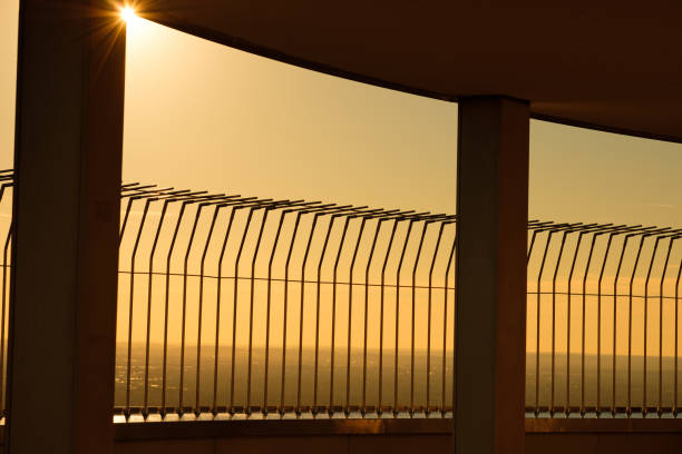 istock Barrier steel fence in backlight 1219378877