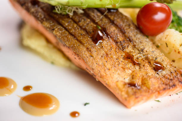Grilled salmon fillet with mash potato and vegetable