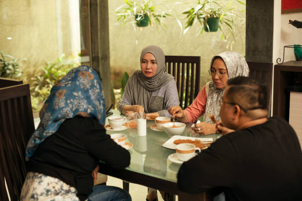 istock happy asian friends having iftar together 1219379762