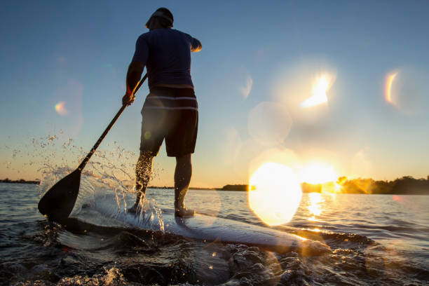 istock Paddle-boarding with water drops in the lens. 1219380425
