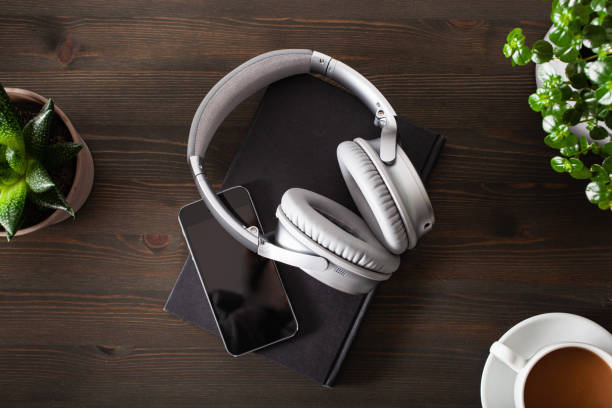 istock audiobook concept modern wireless headphones smartphone book 1219381024