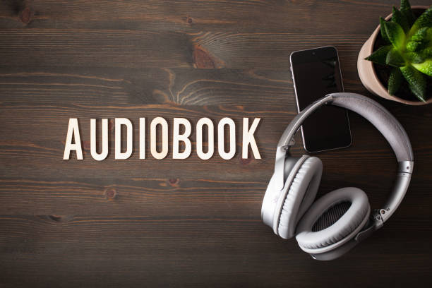 istock audiobook word text concept modern wireless headphones smartphone 1219381419