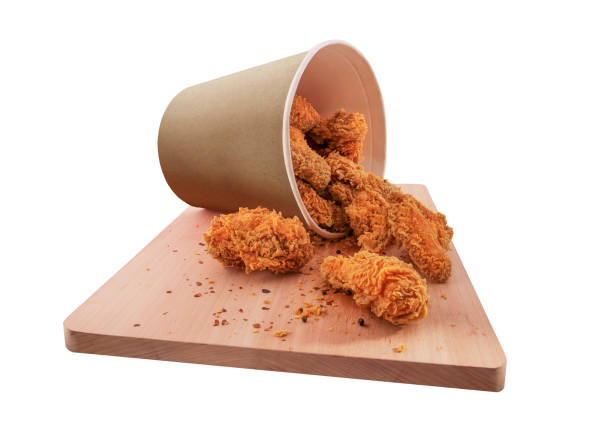 istock Chicken bucket on wooden board isolated on white background 1219382452