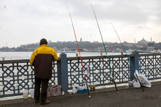 istock Fisherman on the Galata Bridge 1219383741