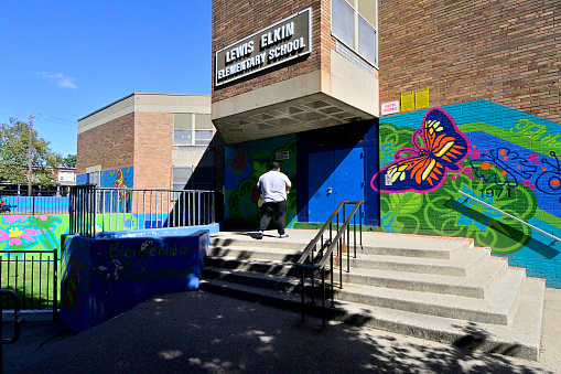 Philadelphia, PA, USA - October 4, 2019; Main Entrance of Lewis Elkin elementary school in the Kensington neighborhood of Philadelphia, PA, on October 4, 2019. Despite school staggers efforts, each morning drug paraphernalia and often addicts and homeless are found near the school building.