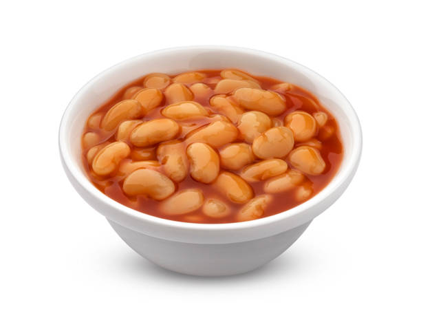 Baked beans in tomato sauce isolated on white background Bowl of baked beans in tomato sauce isolated on white background with clipping path boiled photos stock pictures, royalty-free photos & images