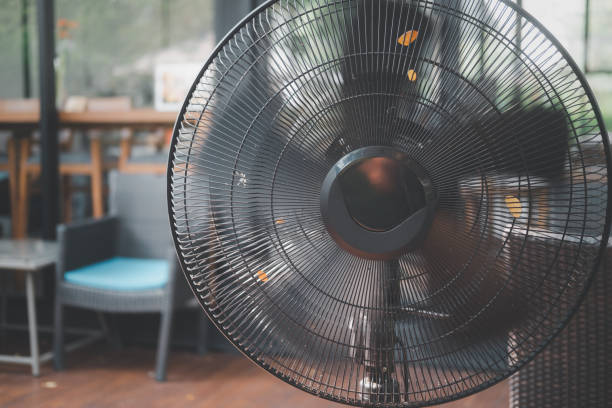 Electric black fan with humidifier in a cafe