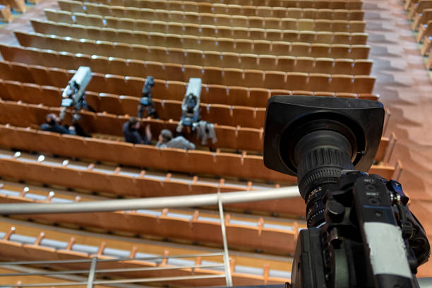 istock tv camera in a concert hall. Digital TV camera. 1219386372