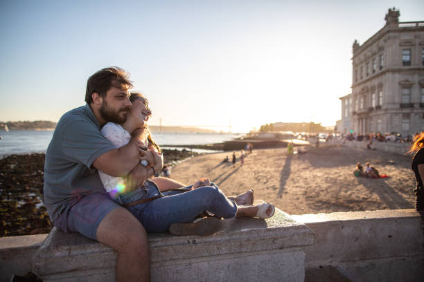 istock Young hipster couple enjoying a beautiful day at beach 1219387348