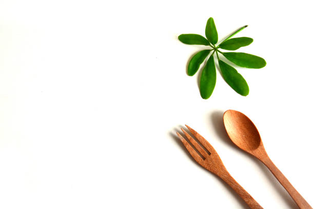 istock Wooden utensils on a white background,spoon,fork with leaf 1219389345