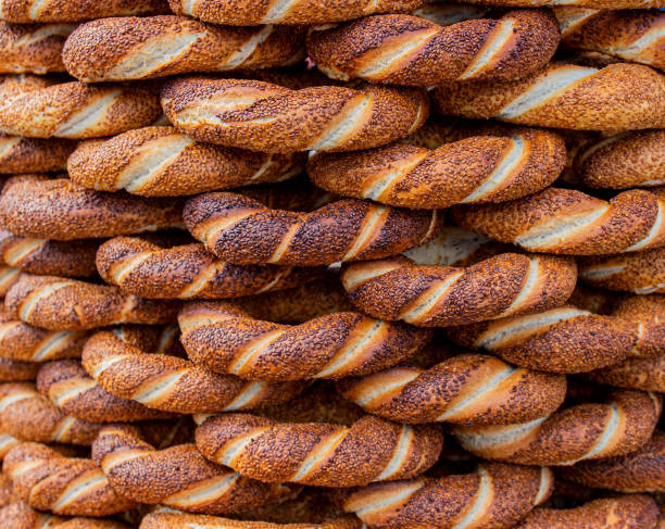Tasty background from Turkish bagel simit with sesame. Traditional popular pastry of Turkey