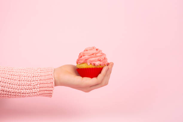 istock Monochrome festive concept with cupcake and pink frosting. Copy space. 1219390842