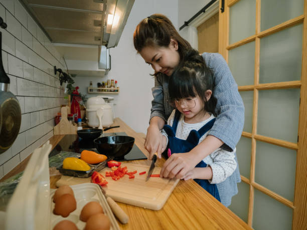 istock Happy asian family in the kitchen. 1219391046