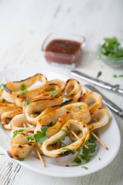 istock Grilled squid rings on a skewer 1219391131