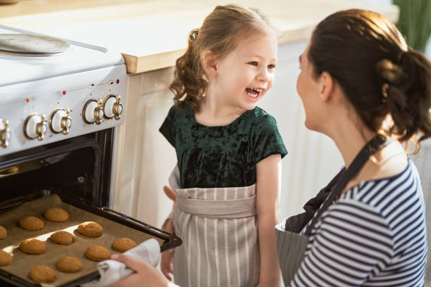 istock Happy family in the kitchen. 1219391417