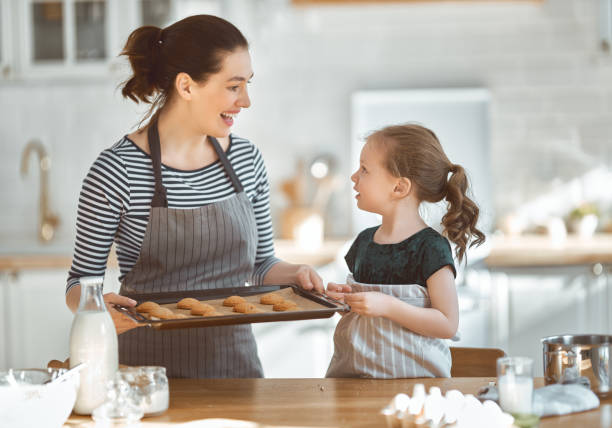 istock Happy family in the kitchen. 1219391422