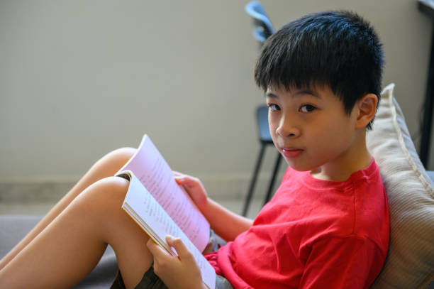 istock Asian boy studying from home 1219392164