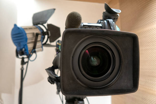 istock Television studio with camera and lights. Digital TV camera 1219392614
