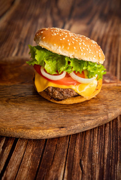 istock homemade hamburger on a wooden board. 1219393197